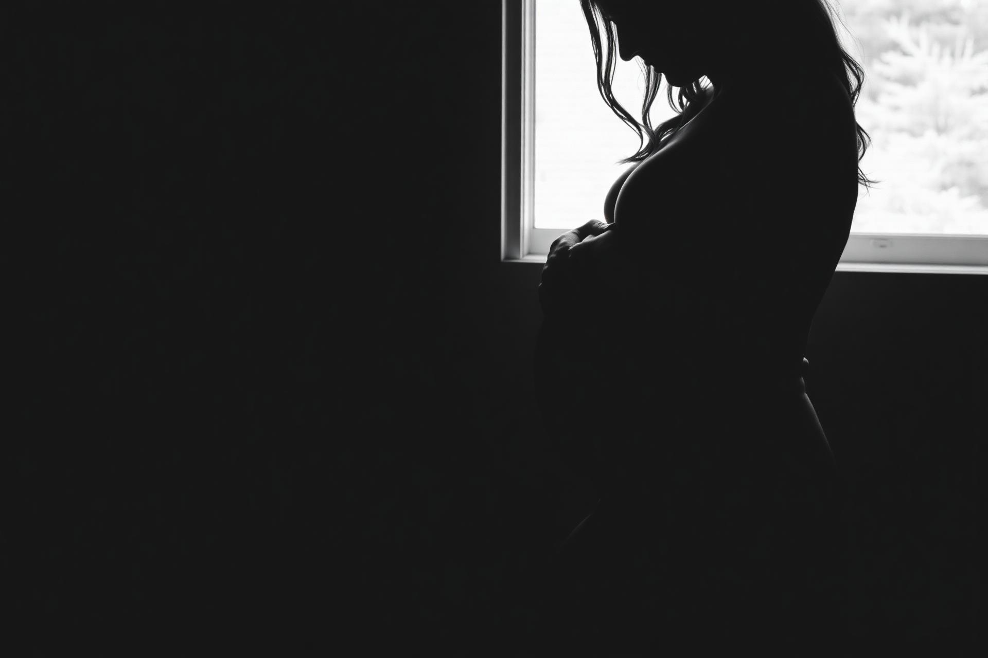 dark B/W · expectant mother